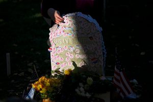 The tombstone of Susan B Anthony, the great campaigner for women's suffrage, covered in "I voted" stickers