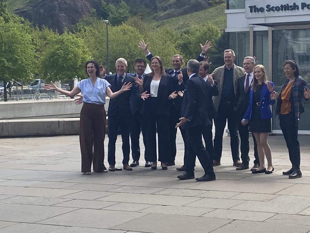 MSPs and Wendy Chamberlain outisde Scottish Parliament