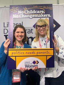 Jo Swinson and Donna Harris pose in "No Childcare, no changemakers, photo frame.