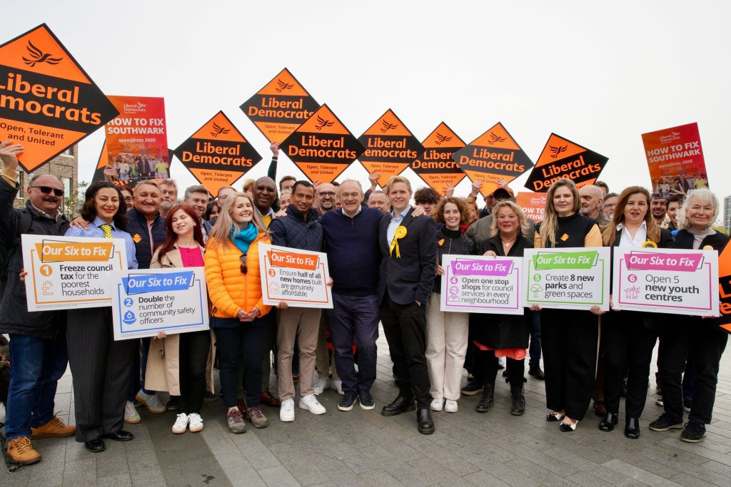 Picture of Southwark Lib Dems surrounded by diamonds and placards with achievements